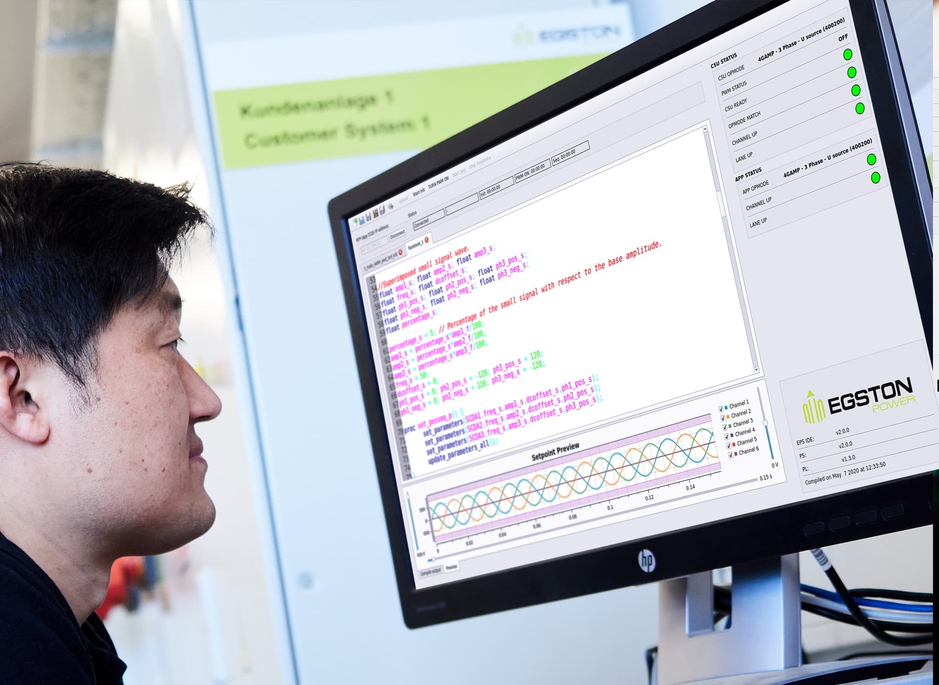 engineer in front of the PC with EGSTON Power App DC-Source on the screen